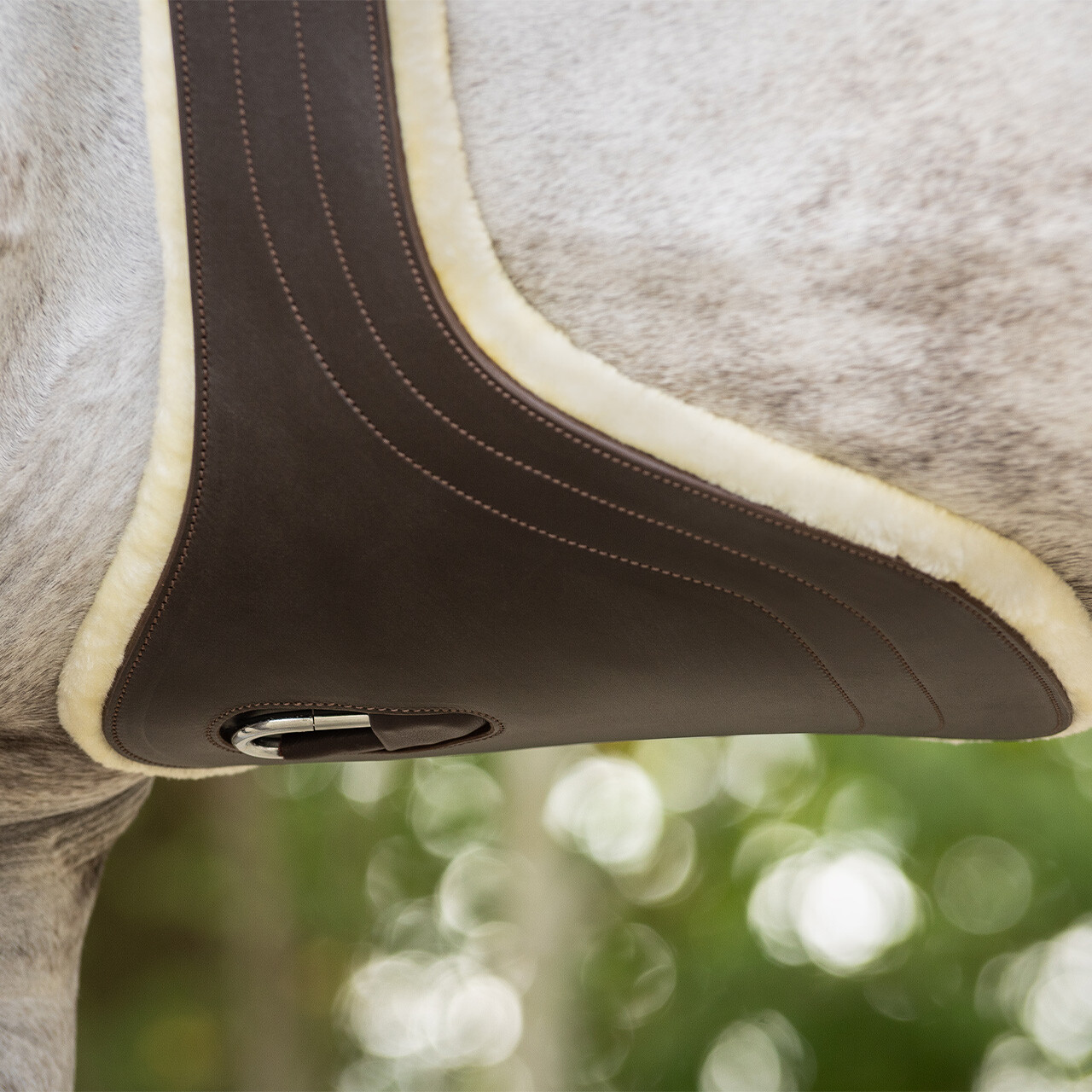 Belly guard girth with removable fur